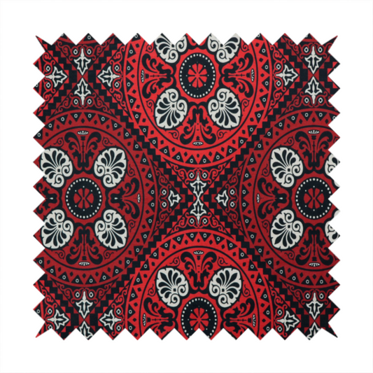 This fabric features an intricate, medallion-style damask pattern with a striking gothic influence. The design is composed of repeating circular motifs containing ornate, symmetrical floral and fan-shaped elements in cream, set against a dark charcoal-black backdrop.