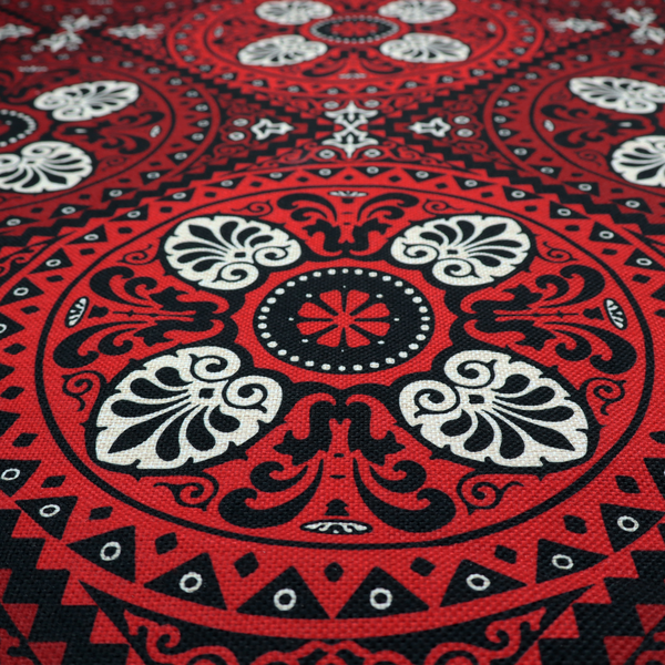 This fabric features an intricate, medallion-style damask pattern with a striking gothic influence. The design is composed of repeating circular motifs containing ornate, symmetrical floral and fan-shaped elements in cream, set against a dark charcoal-black backdrop.