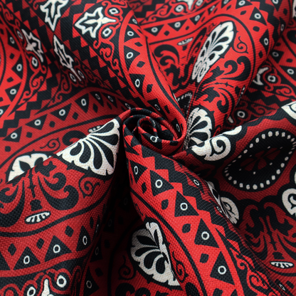 This fabric features an intricate, medallion-style damask pattern with a striking gothic influence. The design is composed of repeating circular motifs containing ornate, symmetrical floral and fan-shaped elements in cream, set against a dark charcoal-black backdrop.