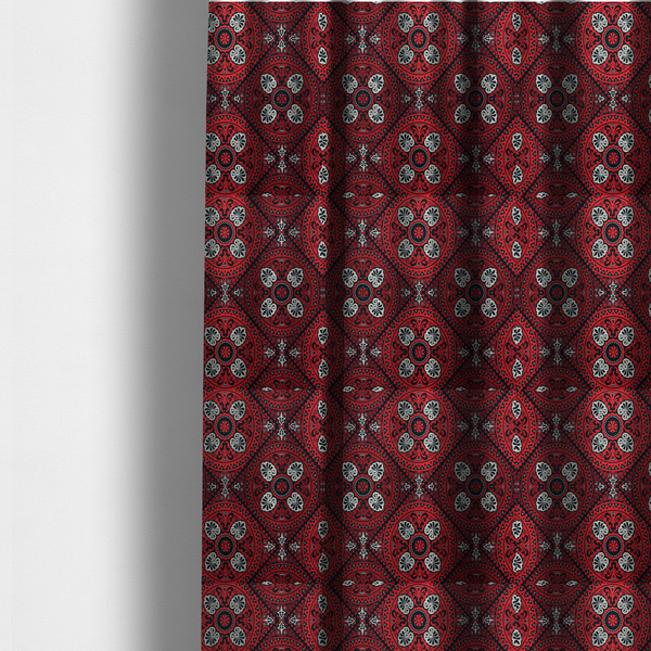 the fabric used to create these made-to-measure curtains is a  fabric features an intricate, medallion-style damask pattern with a striking gothic influence. The design is composed of repeating circular motifs containing ornate, symmetrical floral and fan-shaped elements in cream, set against a dark charcoal-black backdrop.