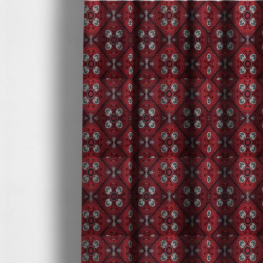 the fabric used to create these made-to-measure curtains is a  fabric features an intricate, medallion-style damask pattern with a striking gothic influence. The design is composed of repeating circular motifs containing ornate, symmetrical floral and fan-shaped elements in cream, set against a dark charcoal-black backdrop.