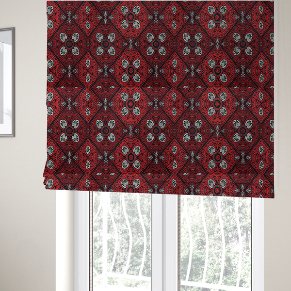 The fabric used to create these Roman blinds is a fabric features an intricate, medallion-style damask pattern with a striking gothic influence. The design is composed of repeating circular motifs containing ornate, symmetrical floral and fan-shaped elements in cream, set against a dark charcoal-black backdrop.