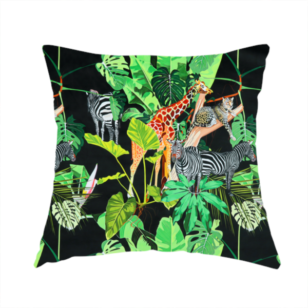 The fabric used to create this handmade cushion is a fabric features a lush, vibrant jungle scene set against a deep black background. The pattern is filled with a dense variety of tropical foliage, including large monstera and palm leaves in multiple shades of green.