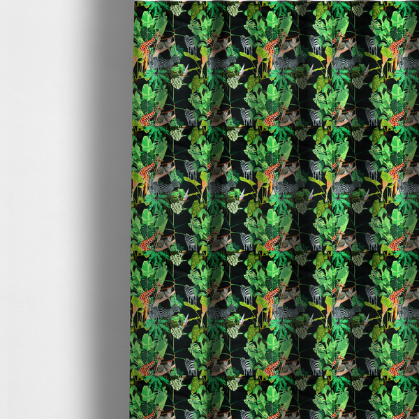 The fabric used to create these made-to-measure curtains is a fabric features a lush, vibrant jungle scene set against a deep black background. The pattern is filled with a dense variety of tropical foliage, including large monstera and palm leaves in multiple shades of green.