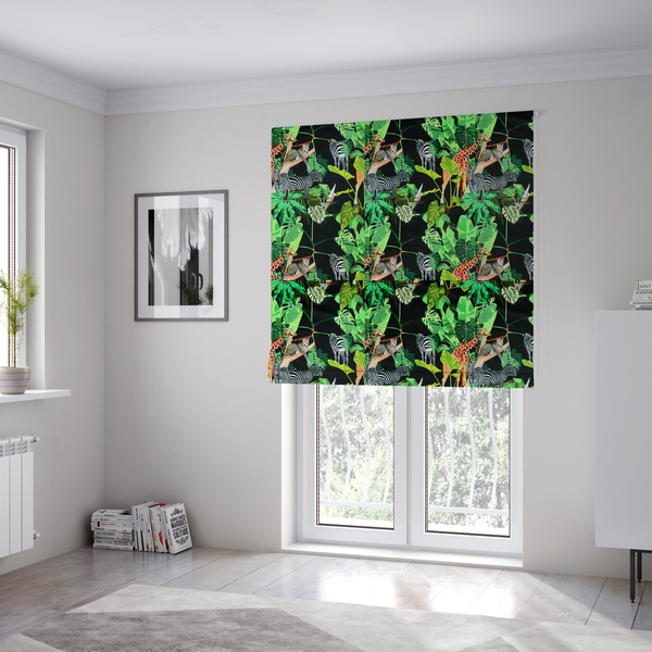 The fabric used to create these Roman blinds is a fabric features a lush, vibrant jungle scene set against a deep black background. The pattern is filled with a dense variety of tropical foliage, including large monstera and palm leaves in multiple shades of green.