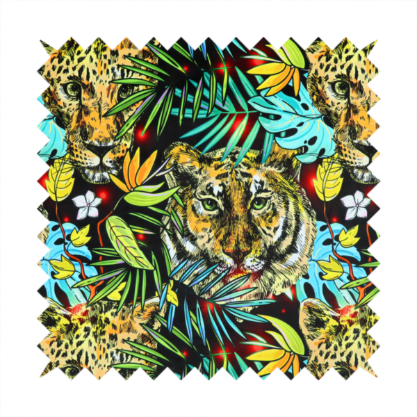 This fabric features a bold, artistic jungle-themed pattern set against a dark black background. The design is a dense, repeating collage of wildlife portraits, featuring alternating heads of leopards and tigers with intense, detailed expressions.