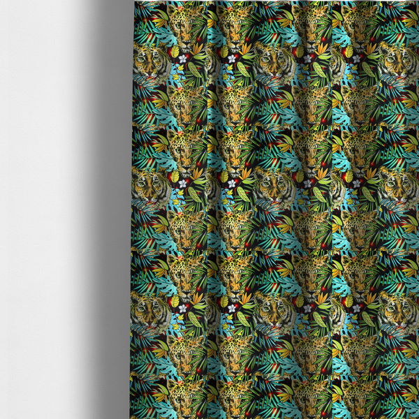 The fabric used to create these made-to-measure curtains is a fabric features a bold, artistic jungle-themed pattern set against a dark black background. The design is a dense, repeating collage of wildlife portraits, featuring alternating heads of leopards and tigers with intense, detailed expressions.