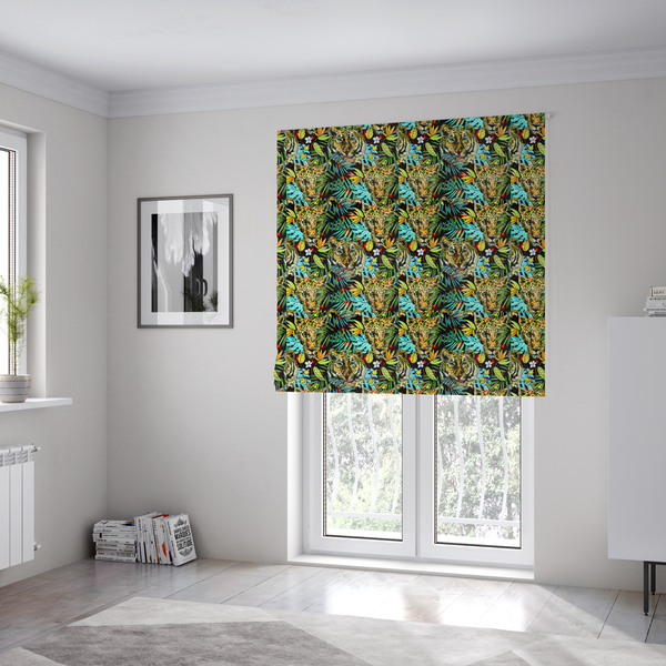 The fabric used to create these Roman blinds is a fabric features a bold, artistic jungle-themed pattern set against a dark black background. The design is a dense, repeating collage of wildlife portraits, featuring alternating heads of leopards and tigers with intense, detailed expressions.