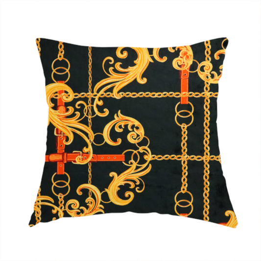 The fabric used to create this handmade cushion is a luxury fashion fabric pattern featuring gold baroque acanthus scrolls layered over a grid of interlocking gold chains and red-orange leather straps on a black background.