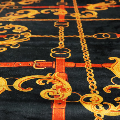 Luxury fashion fabric pattern featuring gold baroque acanthus scrolls layered over a grid of interlocking gold chains and red-orange leather straps on a black background.