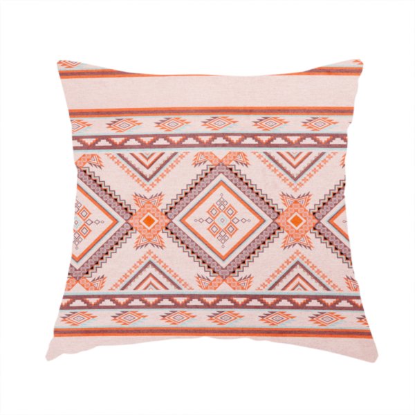 The fabric used to create this handmade cushion is a repeating Southwestern-style fabric pattern featuring geometric diamonds, intricate borders, and horizontal stripes in a palette of coral, turquoise, and earth tones.