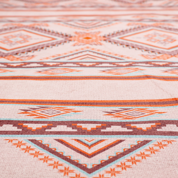A repeating Southwestern-style fabric pattern featuring geometric diamonds, intricate borders, and horizontal stripes in a palette of coral, turquoise, and earth tones.