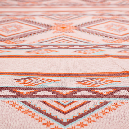 A repeating Southwestern-style fabric pattern featuring geometric diamonds, intricate borders, and horizontal stripes in a palette of coral, turquoise, and earth tones.