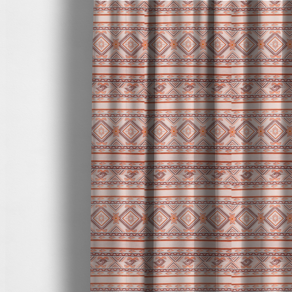 The fabric used to create these made-to-measure curtains is a repeating Southwestern-style fabric pattern featuring geometric diamonds, intricate borders, and horizontal stripes in a palette of coral, turquoise, and earth tones.