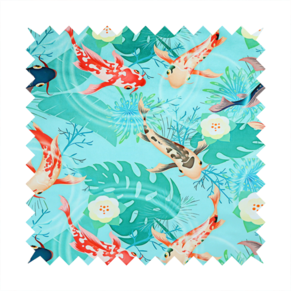 Patterned fabric featuring vibrant orange, white, and dark blue koi fish swimming among lush tropical monstera leaves, water ripples, and white flowers on a light teal background.