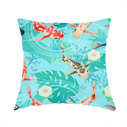 the fabric used to create this handmade cushion is a patterned fabric featuring vibrant orange, white, and dark blue koi fish swimming among lush tropical monstera leaves, water ripples, and white flowers on a light teal background.