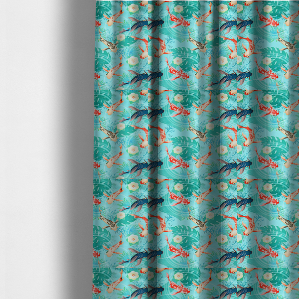 The fabric used to create these made-to-measure curtains is a patterned fabric featuring vibrant orange, white, and dark blue koi fish swimming among lush tropical monstera leaves, water ripples, and white flowers on a light teal background.
