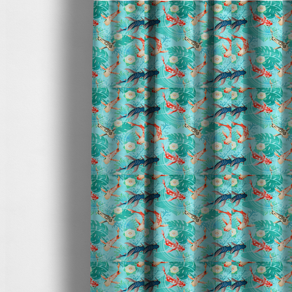 The fabric used to create these made-to-measure curtains is a patterned fabric featuring vibrant orange, white, and dark blue koi fish swimming among lush tropical monstera leaves, water ripples, and white flowers on a light teal background.