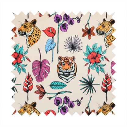 Patterned fabric featuring a repeating design of tiger and leopard heads interspersed with vibrant tropical flowers, orchids, and palm leaves on a cream background.