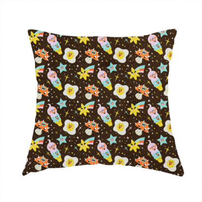 The fabric used to create this handmade cushion is a whimsical, repeating fabric pattern featuring cartoon-style fried eggs, happy ice cream cones, shooting stars, and colourful stars on a dark chocolate brown background.