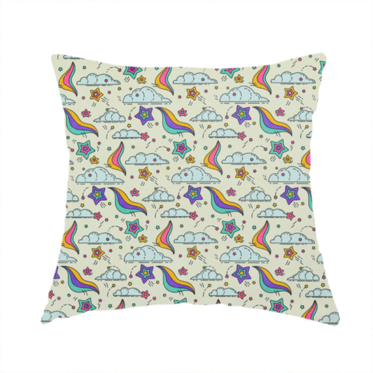 The fabric used to create this handmade cushion is a whimsical, repeating fabric pattern featuring illustrated clouds, colourful shooting stars, and twinkling stars on a light cream background.