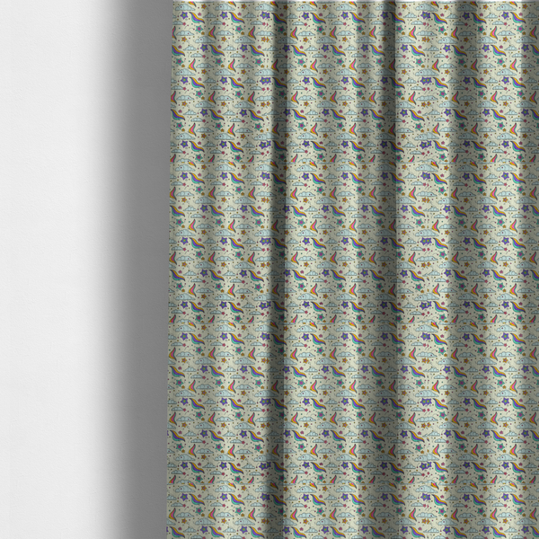 The fabric used to create these made-to-measure curtains is a whimsical, repeating fabric pattern featuring illustrated clouds, colourful shooting stars, and twinkling stars on a light cream background.
