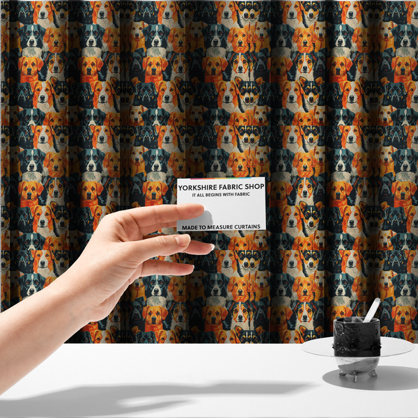 The fabric used to create these made-to-measure curtains is a vibrant fabric pattern featuring a dense, repeating arrangement of detailed, illustrated dog portraits of various herding breeds in bold orange, black, and cream colours.