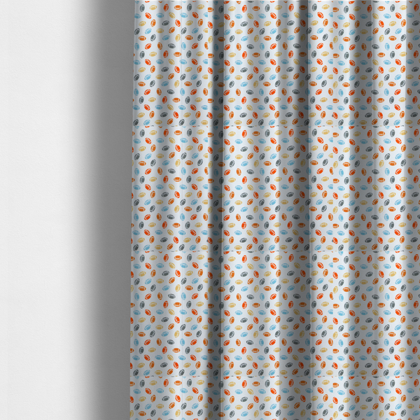 The fabric used to create these made-to-measure curtains is a white fabric featuring a playful, repeating pattern of small American footballs.