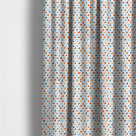 The fabric used to create these made-to-measure curtains is a white fabric featuring a playful, repeating pattern of small American footballs.