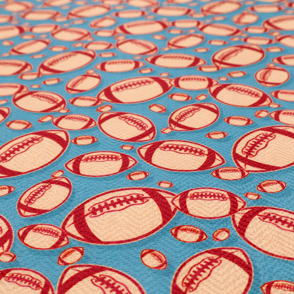 A vibrant blue fabric featuring a dense, repeating pattern of American footballs.