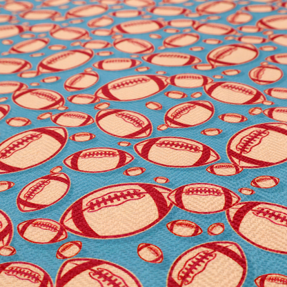 A vibrant blue fabric featuring a dense, repeating pattern of American footballs.