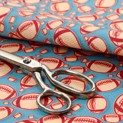 A vibrant blue fabric featuring a dense, repeating pattern of American footballs.
