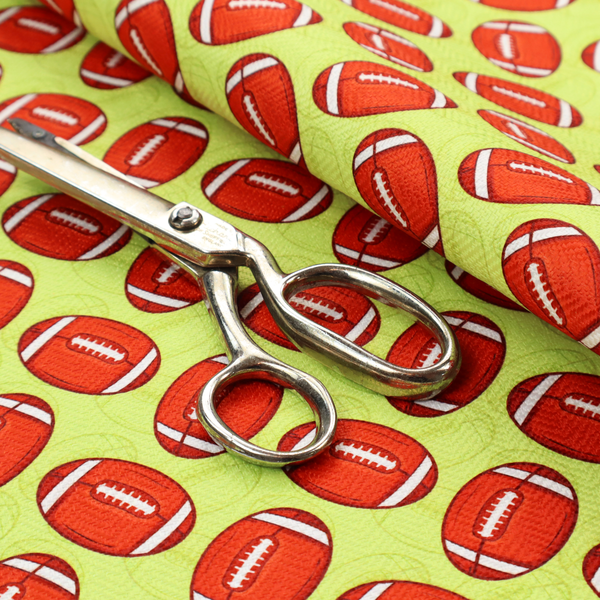 A vibrant lime green fabric featuring an orderly, repeating pattern of American footballs.