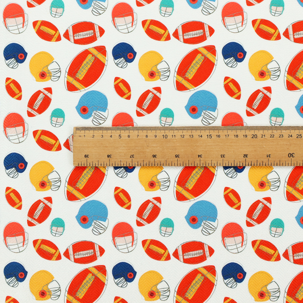 A clean white fabric featuring a playful, repeating pattern of American footballs and helmets.