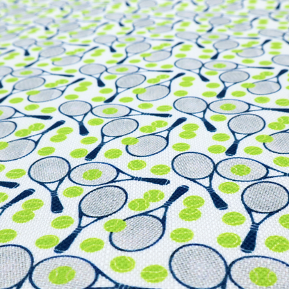 A white fabric featuring a vibrant, repeating pattern of tennis rackets and tennis balls.