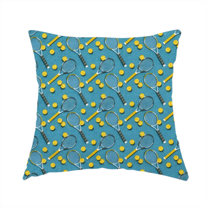 The fabric used to create this handmade cushion is a  cool medium-blue fabric featuring a structured, repeating tennis pattern.