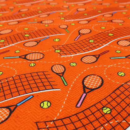 a vibrant burnt orange fabric featuring a dynamic, repeating tennis-themed pattern.