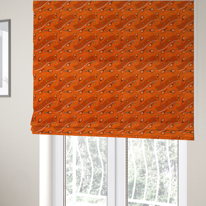 The fabric used to create these Roman blinds is a vibrant burnt orange fabric featuring a dynamic, repeating tennis-themed pattern.