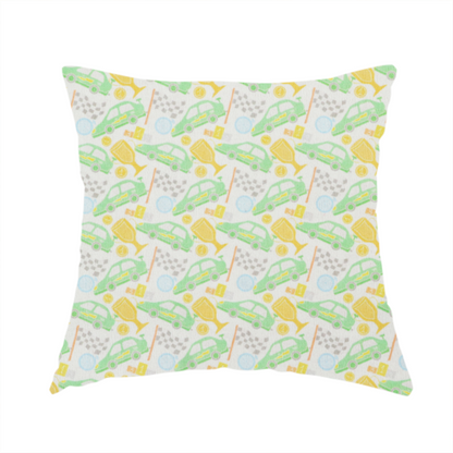 The fabric used to create this handmade cushion is a soft white fabric featuring a charming, repeating racing-themed pattern in a pastel colour palette.