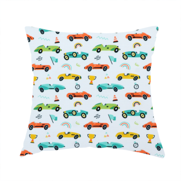 The fabric used to create this handmade cushion is a fabric featuring a whimsical, repeating pattern of vintage-style racing cars and track accessories.