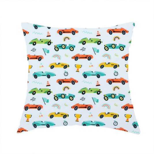 The fabric used to create this handmade cushion is a fabric featuring a whimsical, repeating pattern of vintage-style racing cars and track accessories.