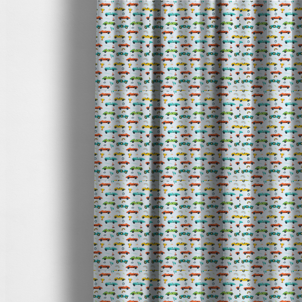 The fabric used to create these made-to-measure curtains is a fabric featuring a whimsical, repeating pattern of vintage-style racing cars and track accessories.