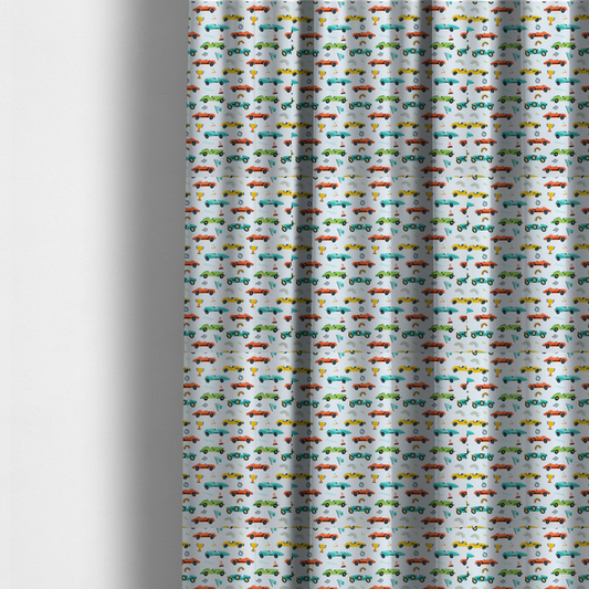The fabric used to create these made-to-measure curtains is a fabric featuring a whimsical, repeating pattern of vintage-style racing cars and track accessories.