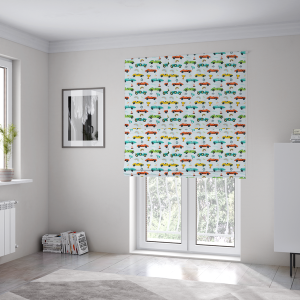 The fabric used to create these Roman blinds is a fabric featuring a whimsical, repeating pattern of vintage-style racing cars and track accessories.