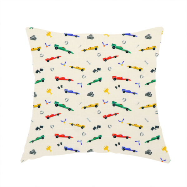 The fabric used to create this handmade cushion cream-coloured fabric featuring a detailed, repeating pattern of Formula 1-style racing cars and track elements.