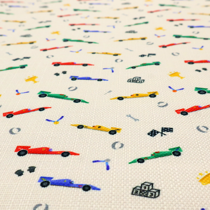 A cream-coloured fabric featuring a detailed, repeating pattern of Formula 1-style racing cars and track elements.