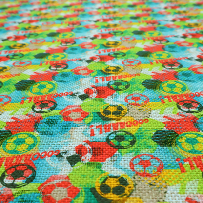 A highly energetic and colourful fabric featuring a soccer-themed graffiti pattern.