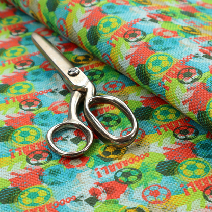 A highly energetic and colourful fabric featuring a soccer-themed graffiti pattern.