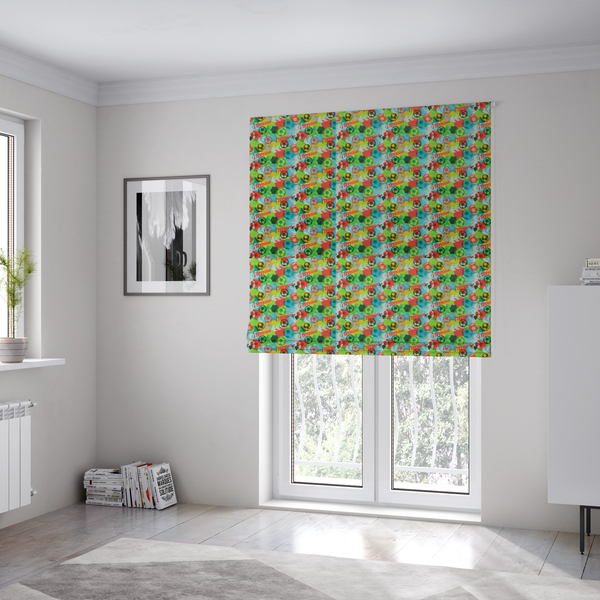 The fabric used to create these Roman blinds is a highly energetic and colourful fabric featuring a soccer-themed graffiti pattern.