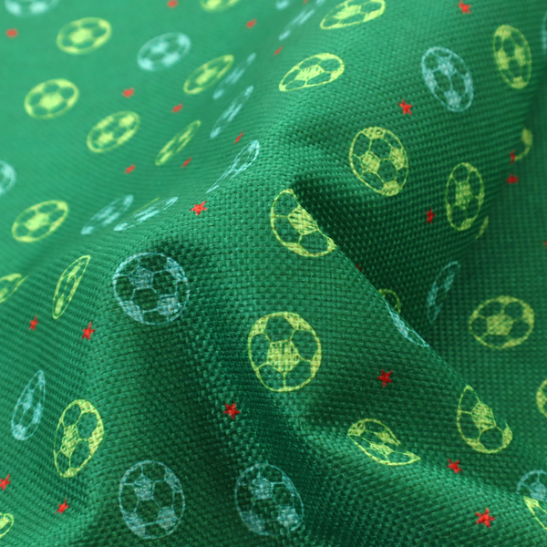 a rich emerald green fabric featuring a playful, repeating soccer and stars pattern.